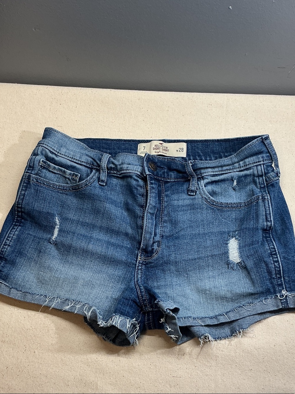 Hollister  short distressed denim jeans shorts in a medium blue wash size 7